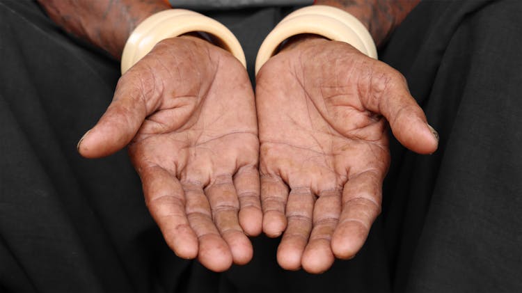 Close-up Of Old Person Working Hands