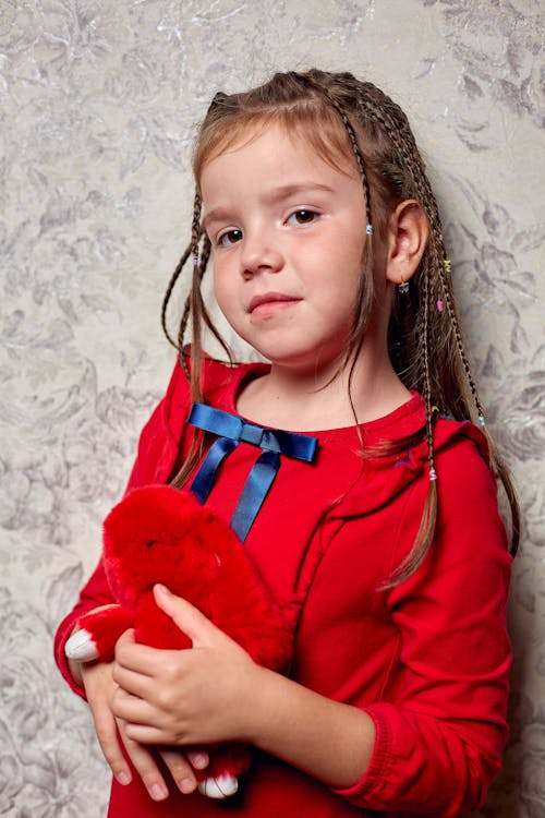 Free Little Girl Holding a Stuffed Toy  Stock Photo