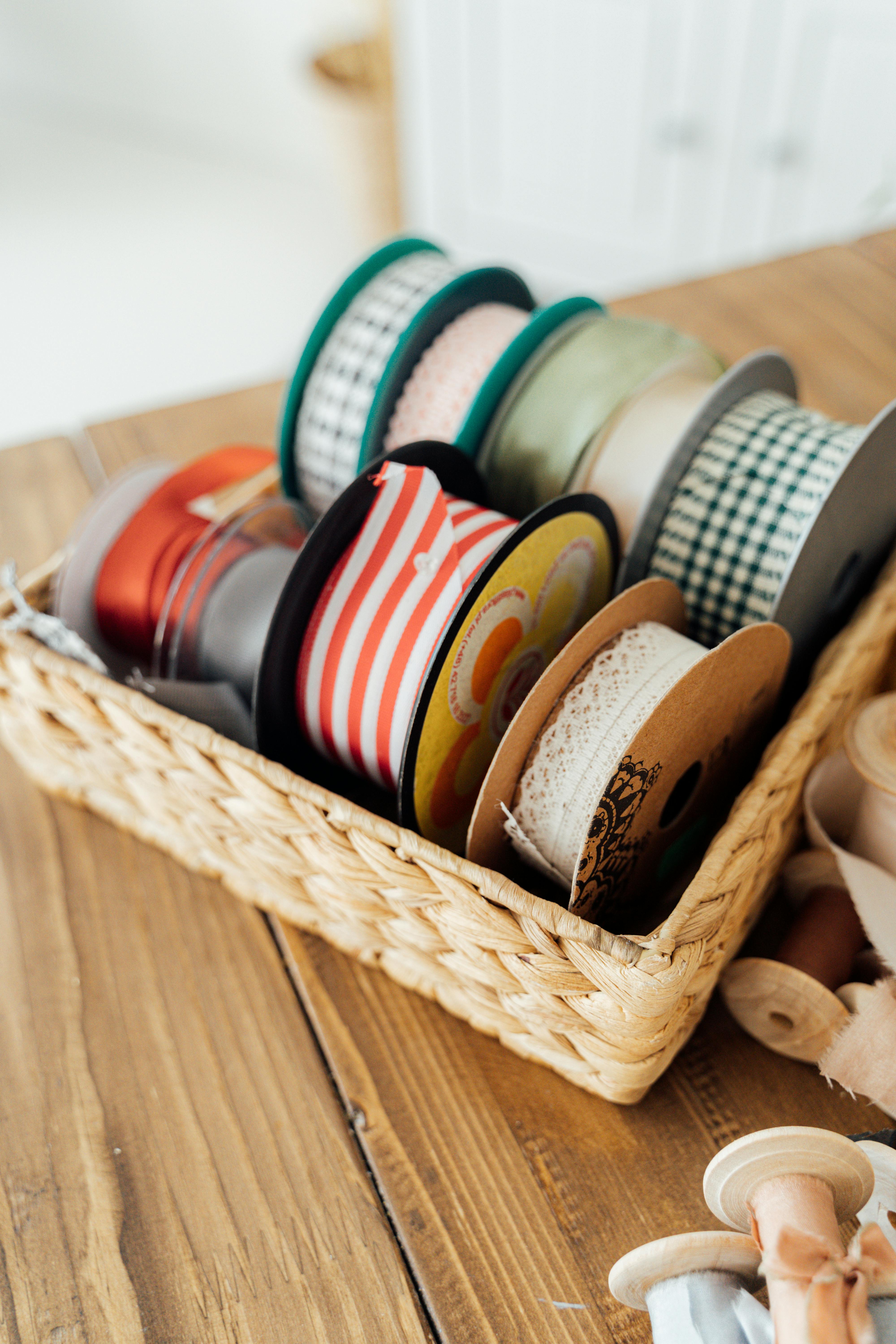 brown wooden basket with assorted paint cans