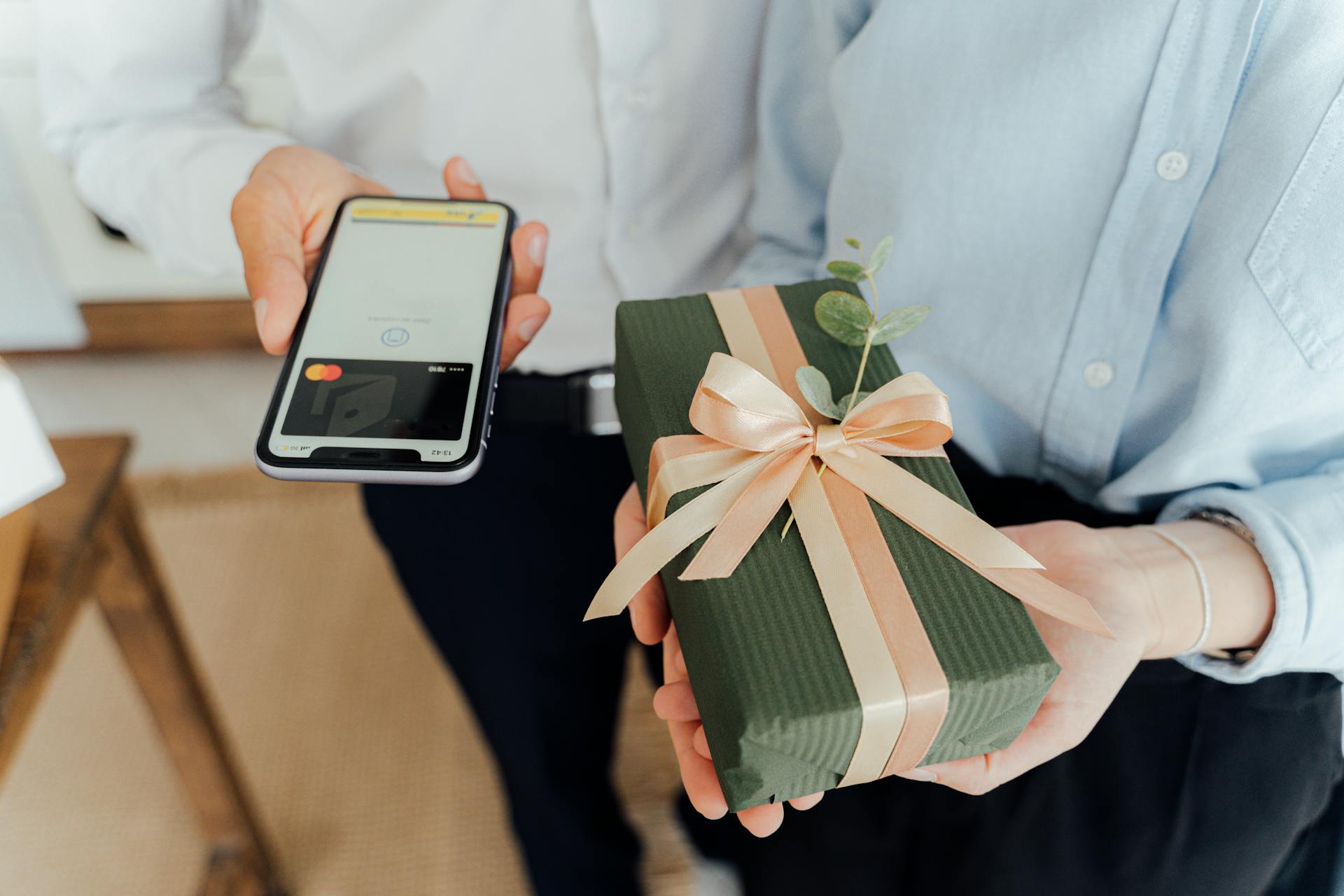 Person Holding Green and White Gift Box