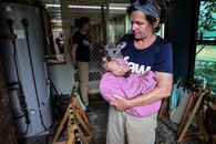 Woman Carrying a Baby Wallaby