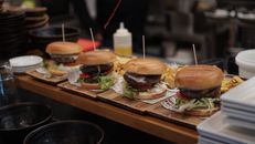 Burger With Lettuce and Tomato on Brown Wooden Tray