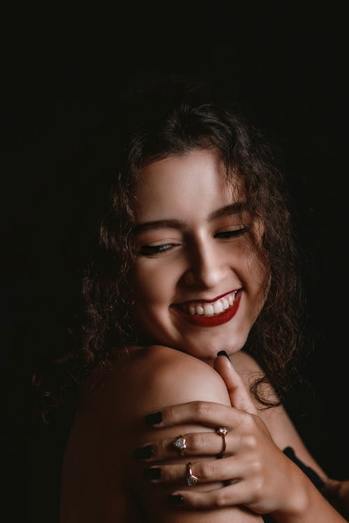 Free Smiling Woman With Black Background Stock Photo