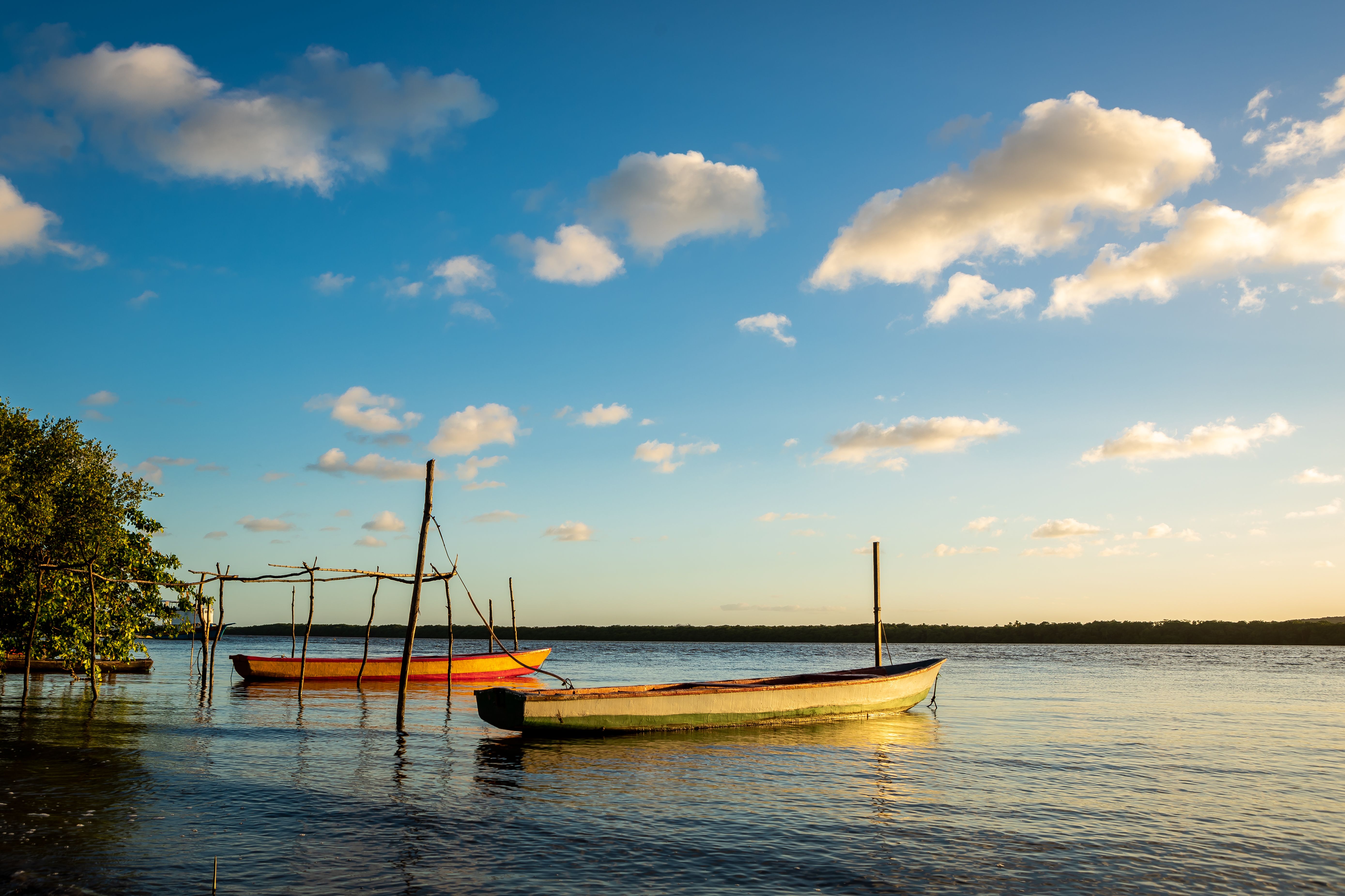A Wooden Boats on the Sea Under the Blue Sky and White Clouds · Free ...