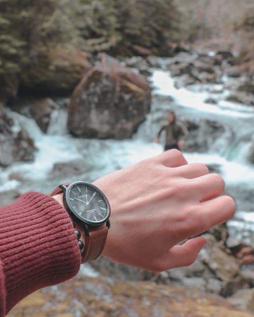 Person Wearing Black Analog Wristwatch