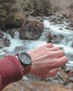 Person Wearing Black Analog Wristwatch