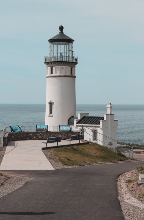 Free White Concrete Lighthouse Near Sea Stock Photo