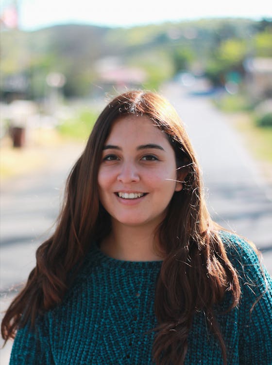 Woman Wearing Green Knitted Sweater Smiling