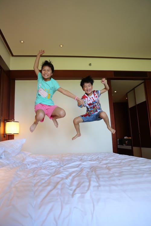 Children Jumping on the Bed