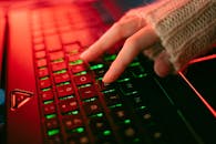 A Person Typing on a Keyboard