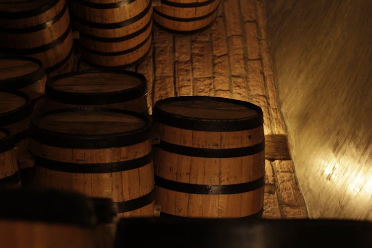 Stack Of Wine Barrels In Cellar