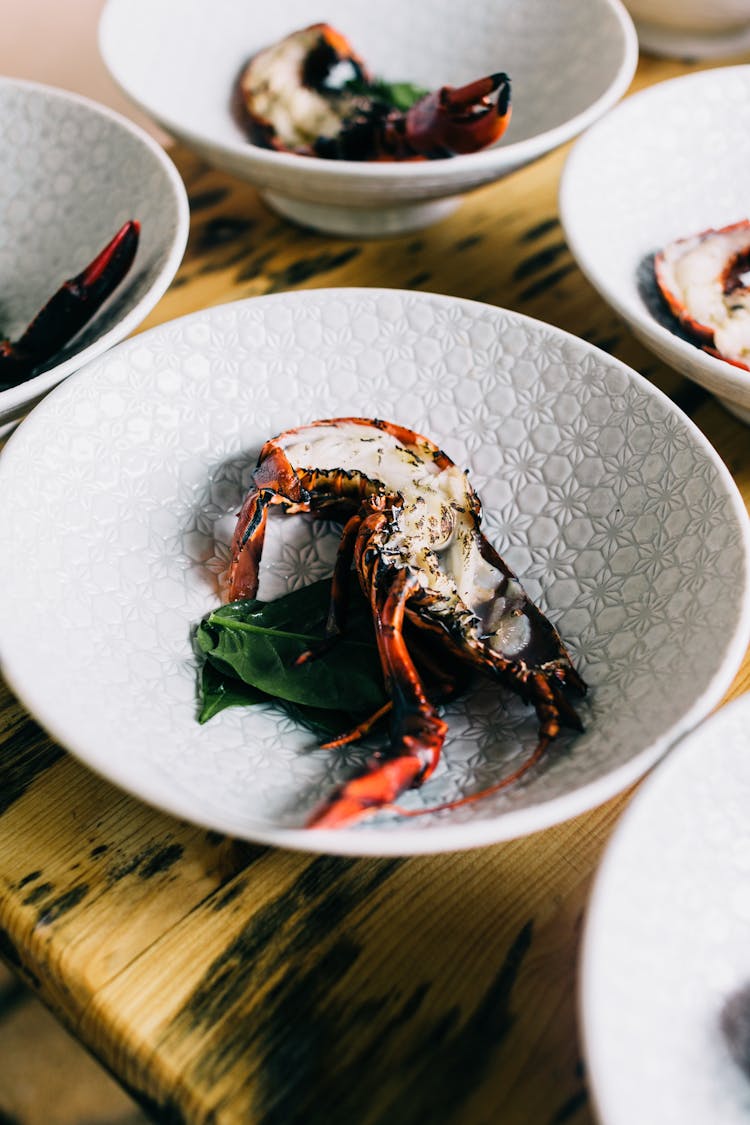 Plates With Lobster On Table