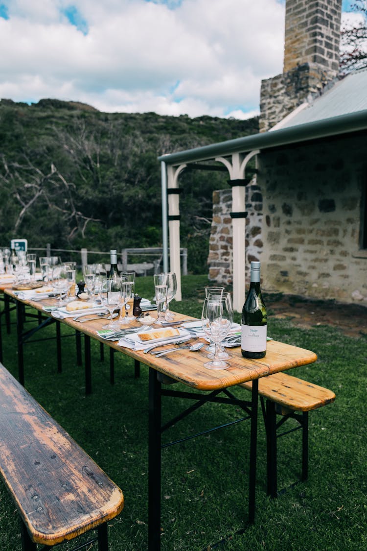 Served Table On Backyard Of Stone House