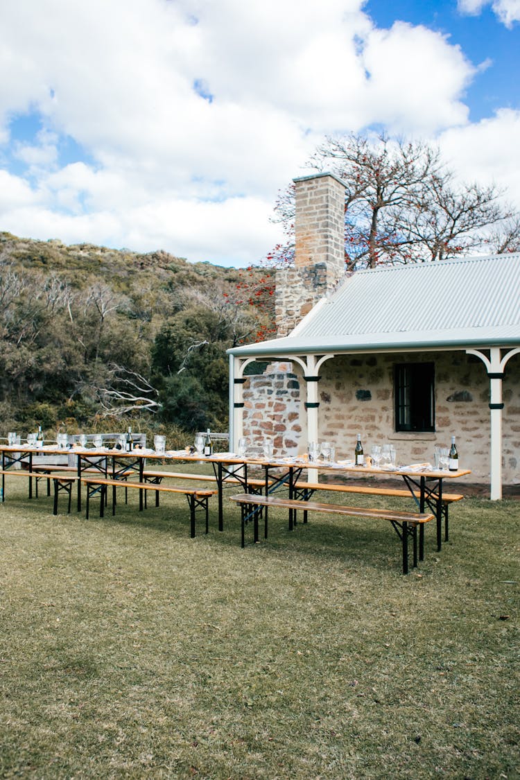 Backyard Of Aged Building With Table