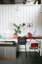 Chair near table in studio with manufactured bag