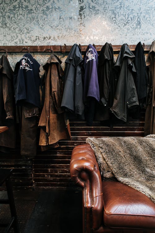 Outerwear hanging in vintage studio with couch