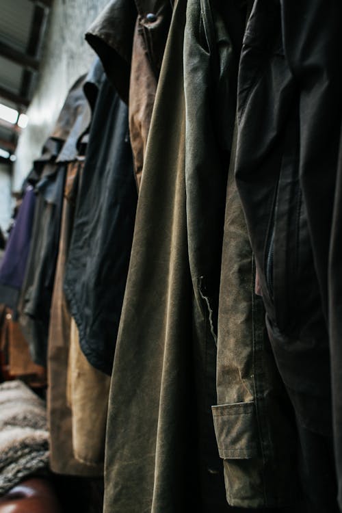 Various clothes hanging at wall