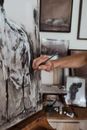 Crop artist drawing on canvas