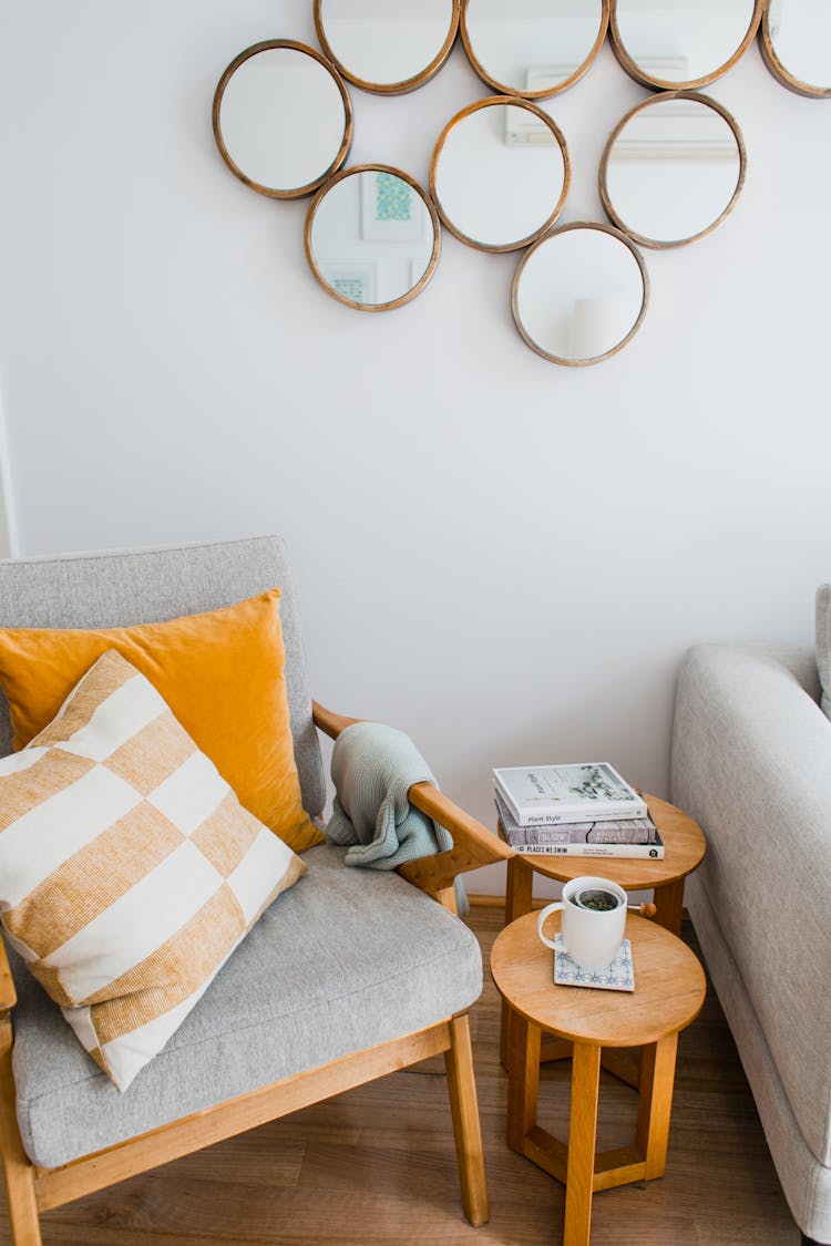 Soft Armchair Near Side Table In Room