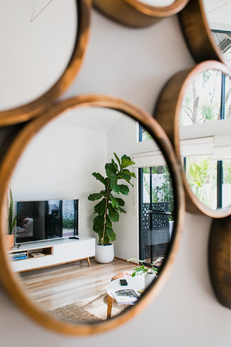 Mirrors Reflecting Interior Of Modern Lounge