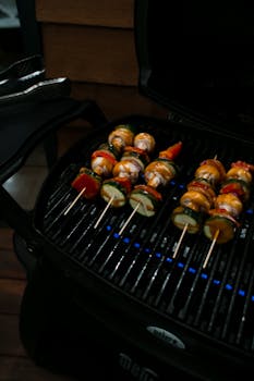 From above of delicious healthy vegetables roasting on hot contemporary grill in daytime