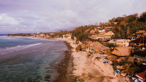 Small coastal village near waving blue sea