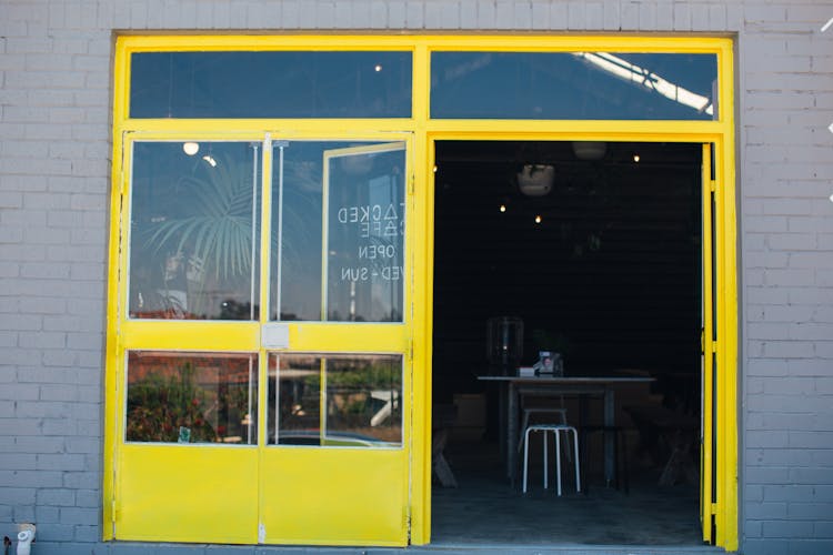 Bright Yellow Entrance Of Modern Cafe