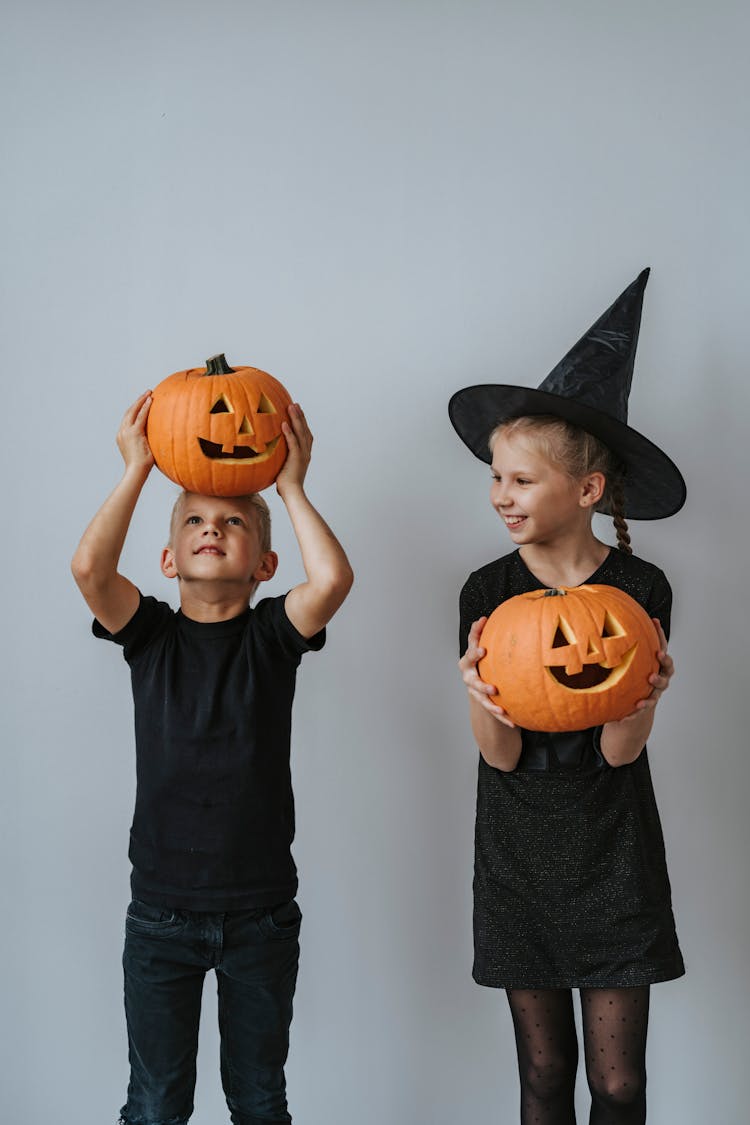 Boy And Girl Holding Jack O Lantern