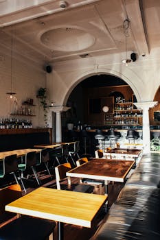 A cozy and stylish bar and lounge interior with elegant furnishings and warm atmosphere for dining.