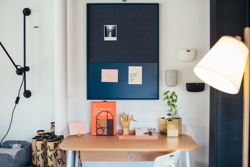 wooden balance board positioned at a standing desk