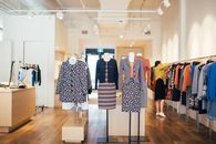Mannequins in trendy clothes placed in stylish shop