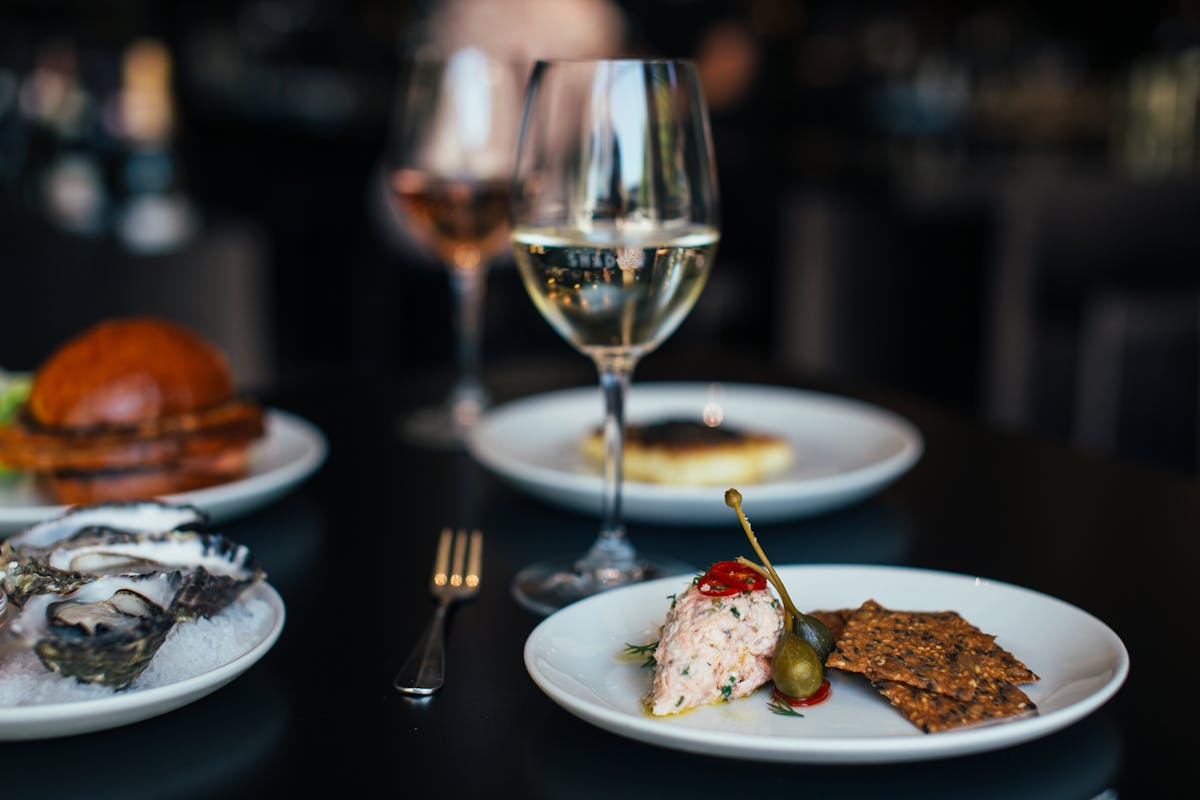 Assortment of fermented foods including kimchi, sauerkraut, and pickles in small bowls