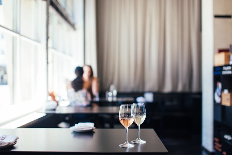 Wineglasses With Wine On Table In Cafe