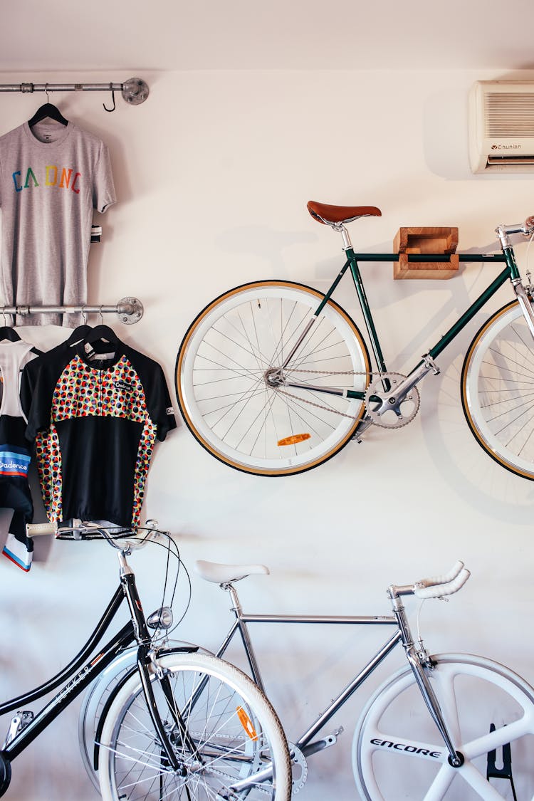 Bicycles Near Wall With Clothes