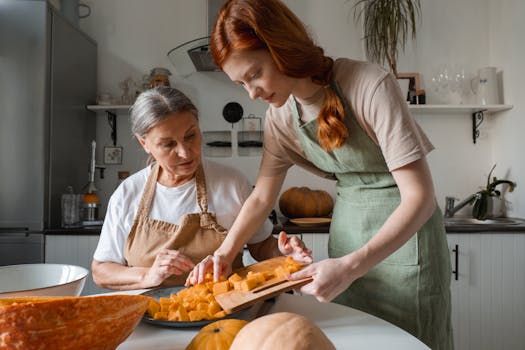 A mother and daughter prepare diced squash in their kitchen. Perfect for family and home cooking themes.
