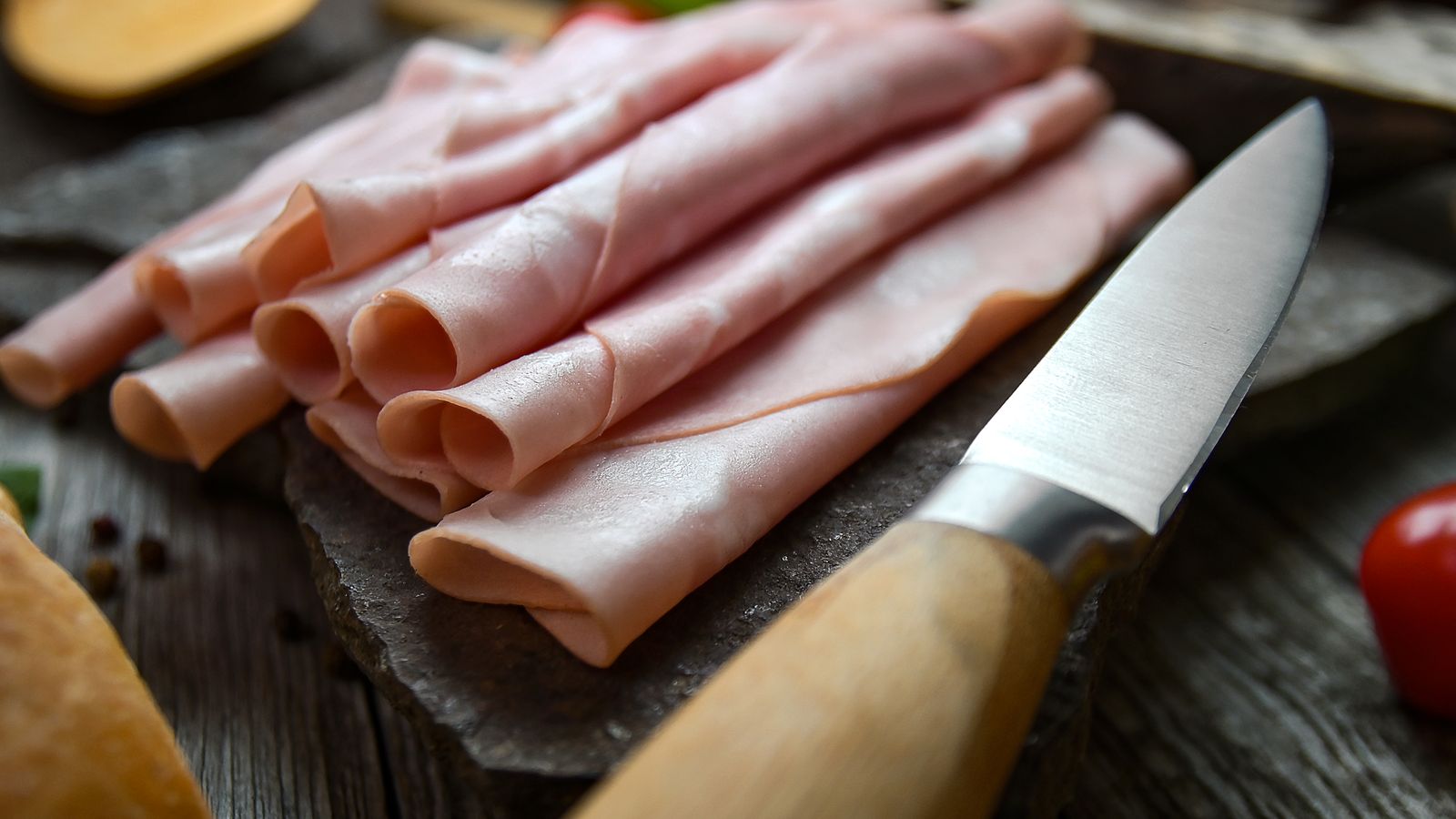 Freshly sliced ham with a knife — photo by Adonyi Gábor on Pexels Freshly sliced ham with a knife