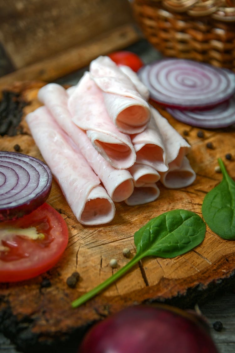 Sliced Meat On Brown Wooden Chopping Board