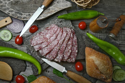 Free Salami Slices on a Stone Slab  Stock Photo