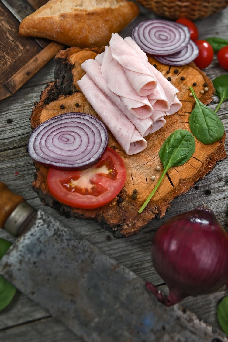 Sliced Ham On Wooden Chopping Board