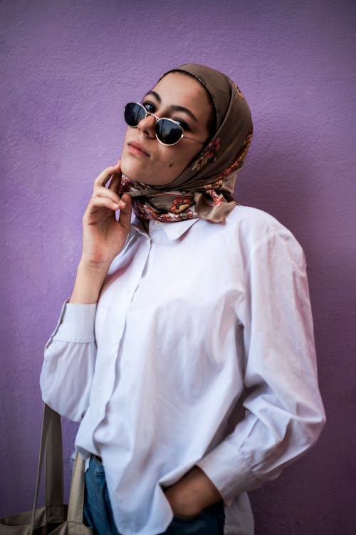 Woman in White Long Sleeve Shirt Wearing Brown Hijab