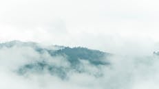 Thick Fog Covering Hilly Landscape