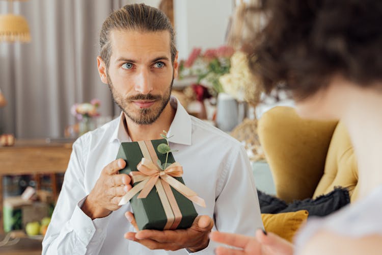 Bearded Man Holding A Gift Box