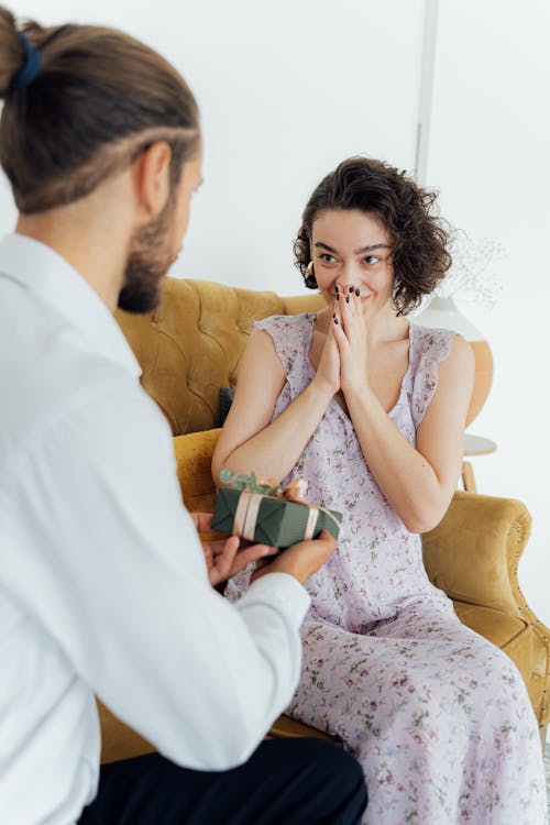 Free Man Giving Woman a Gift Stock Photo