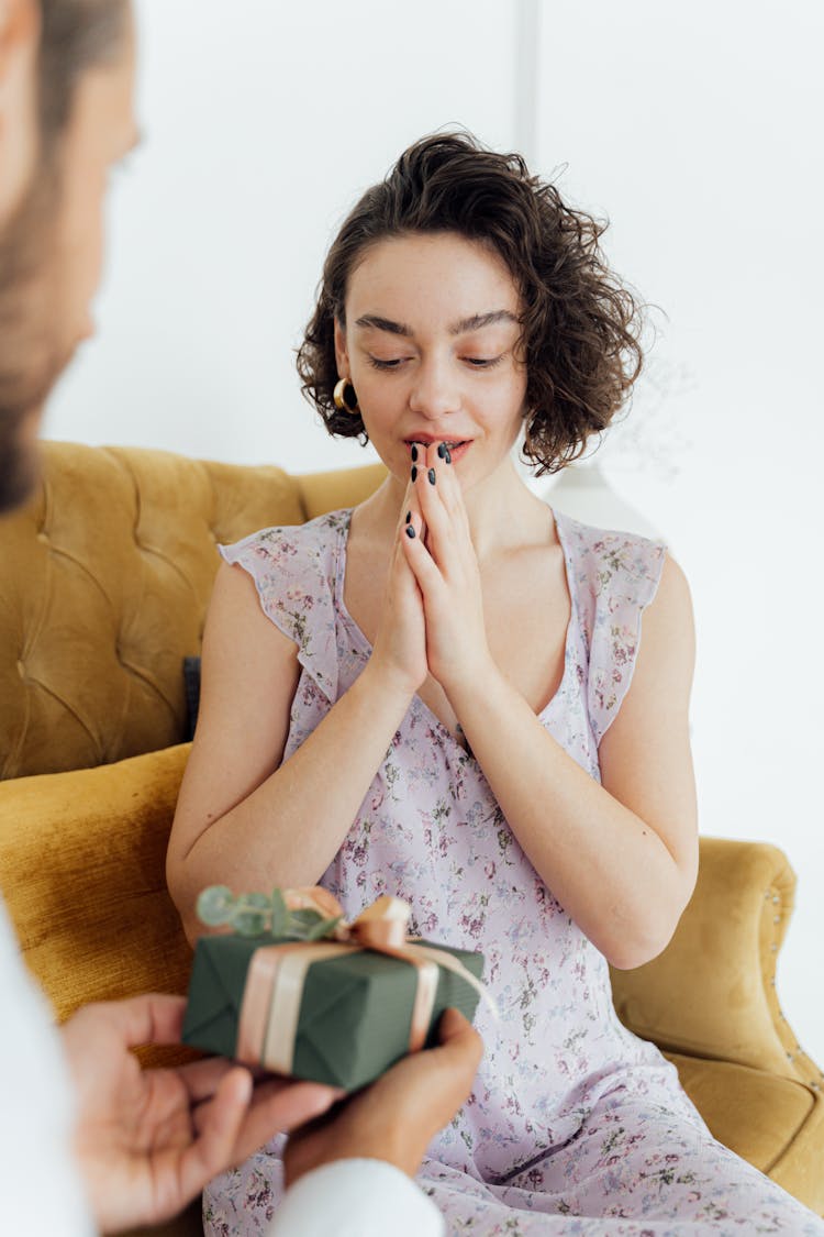 A Woman Receiving A Gift