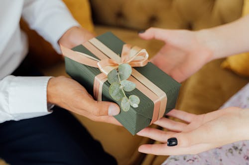 Free Person Giving a Gift Box Stock Photo