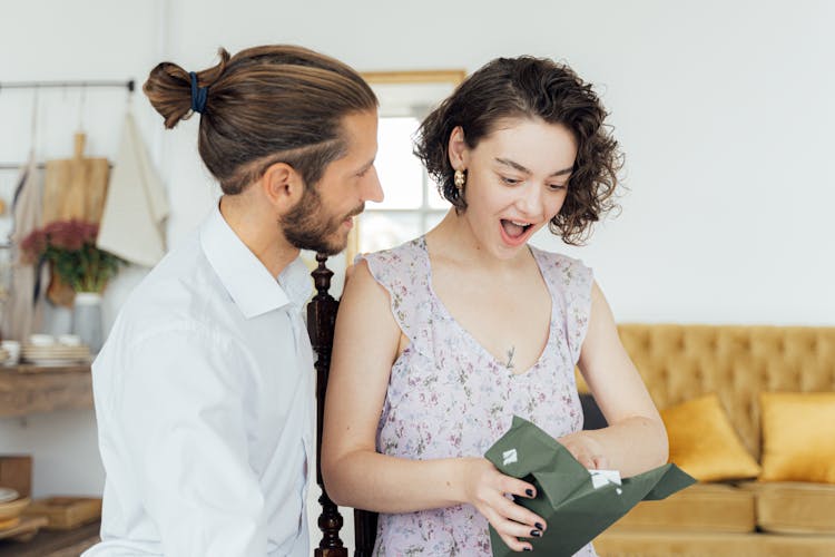 A Woman Opening A Present