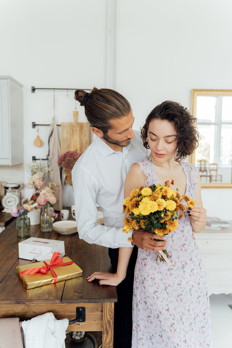 Man Giving Flowers To A Woman