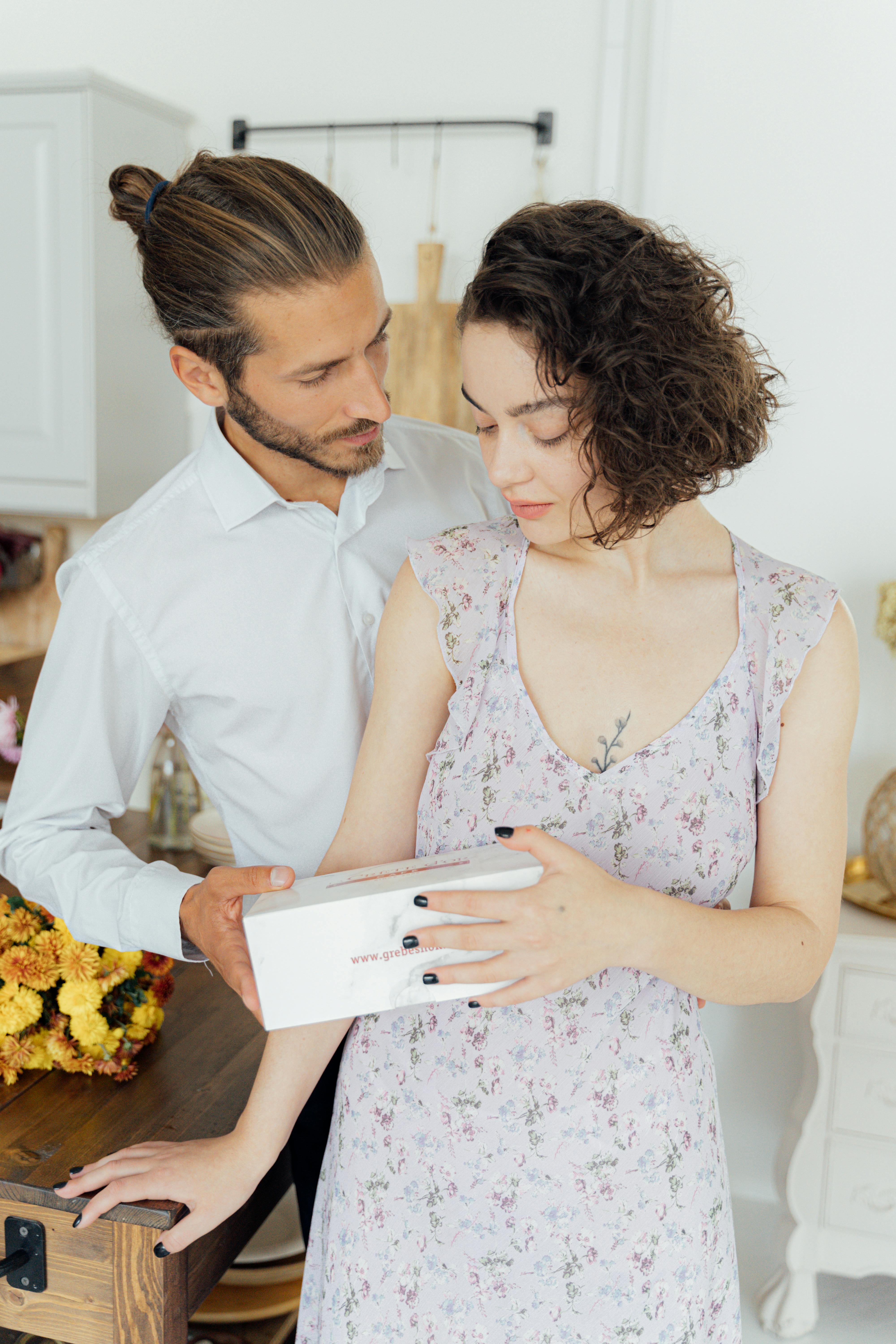 a husband giving his wife a present