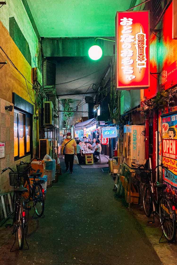 People Sitting At An Izakaya In Japan