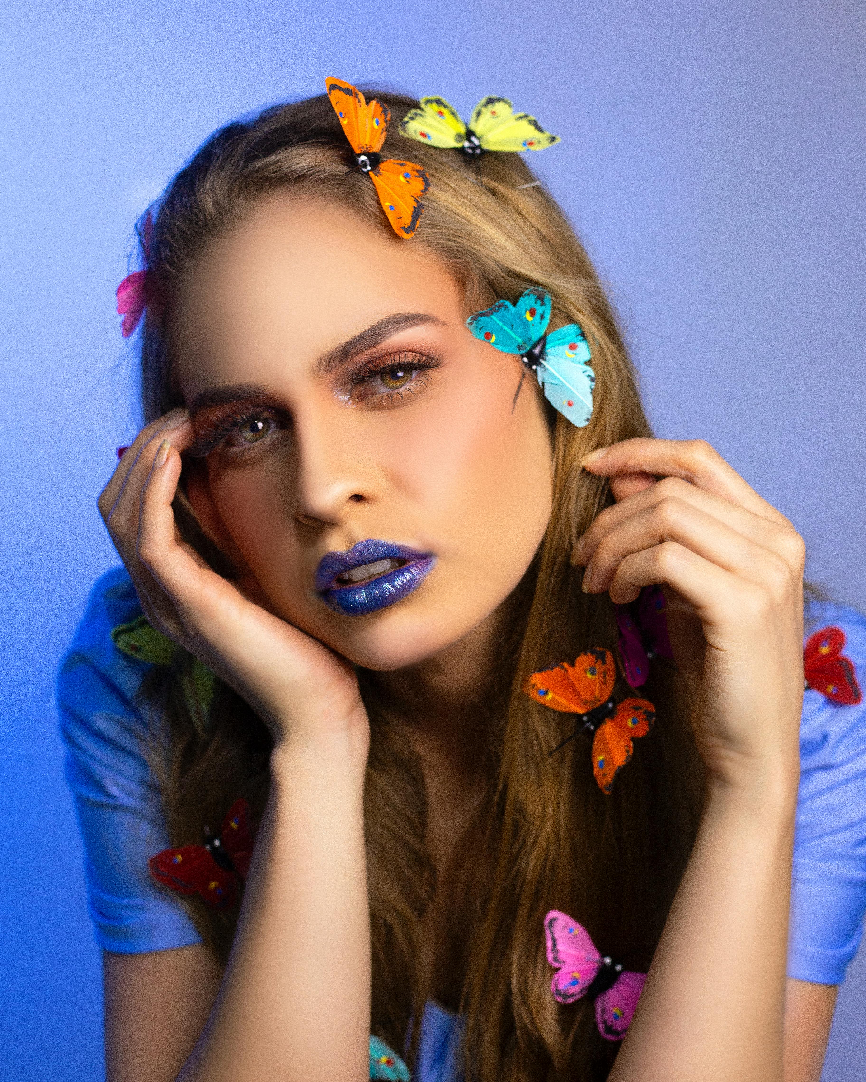 bright dreamy woman with colorful butterflies